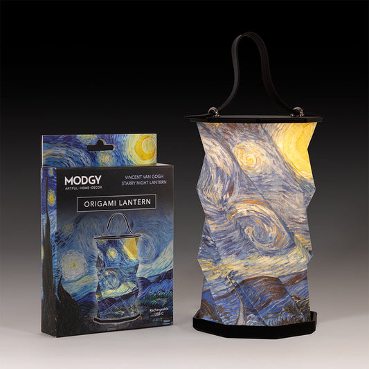 Starry Night origami lantern lit, beside its package